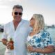 Spirit of Cairns cruises - couple enjoying drinks on deck